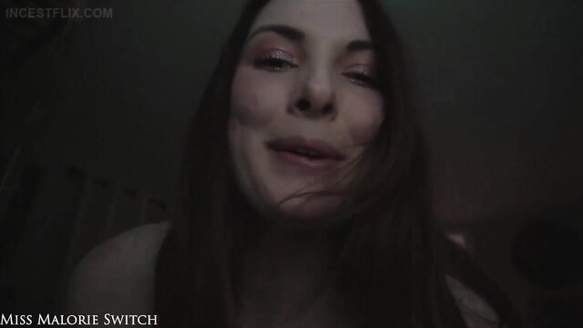 Miss Malorie Switch topless step-sister smirks seductively closeup