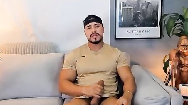 Muscular Latino man stroking huge cock solo in tight tee