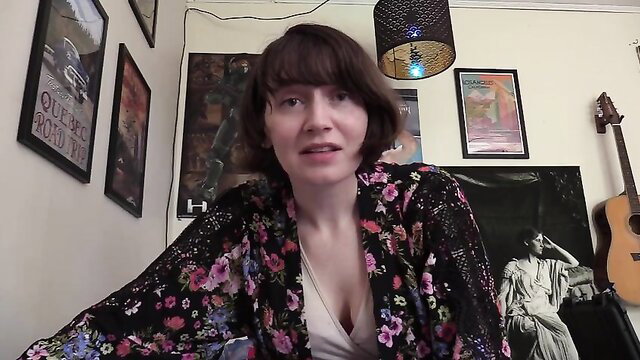 Bettie Bondage in revealing floral kimono top, deep cleavage tease