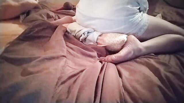 coupleforyou23 in white diaper, feet soles up close on bed