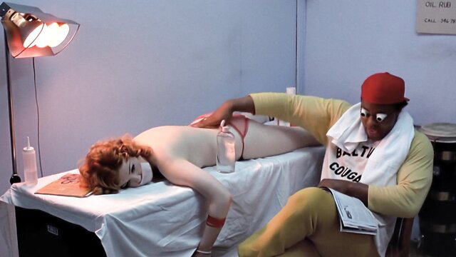 Brandy Wilde nude on table, Laura Hippe massages in Stay Hungry 1976