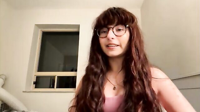 Elisehart petite camgirl with glasses, bangs, wavy red hair smiling