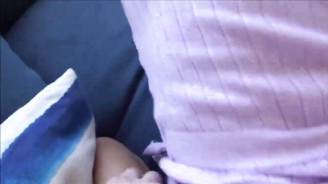 POV closeup of busty MILF in sheer pink top giving blowjob on bed