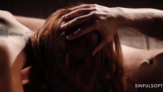 Lenina Crowne topless with red hair, Stanley Johnson gripping her head passionately