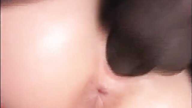 Closeup of woman's glossy pink lips and chin in BBC semenvozo scene
