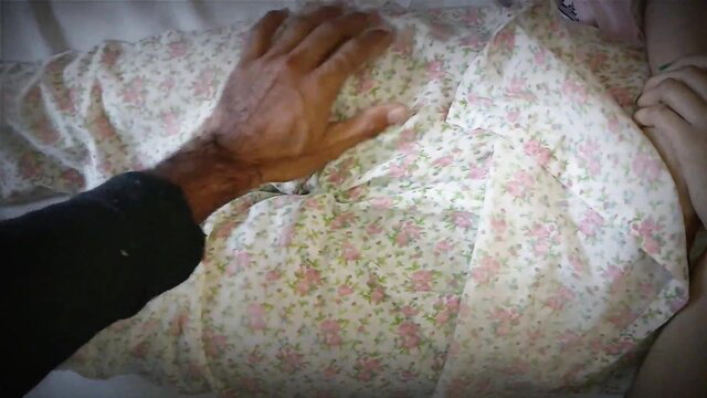 Indian Desi Hancock stepson gropes her floral nightie-clad tits in bed