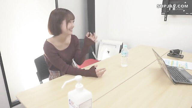 Hoshi Noriko JAV star in tight maroon top and skirt, smiling seductively