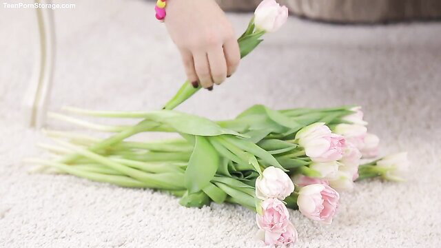 Teena Lipoldino holding pink tulips, hot solo tease