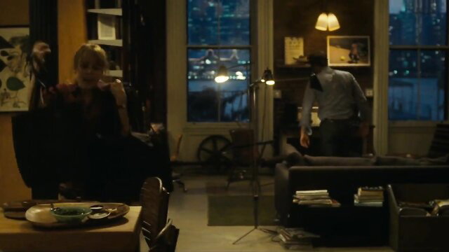 Rachel McAdams as Becky in elegant black dress, sophisticated apartment scene