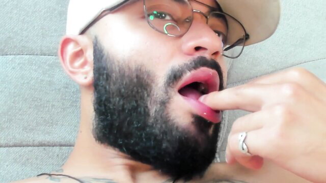 BLAZEXLIVE licks lips and fingers tongue in sensual webcam close-up