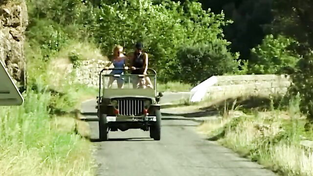 Hot blonde MILF Marie rides in jeep with man on sunny road
