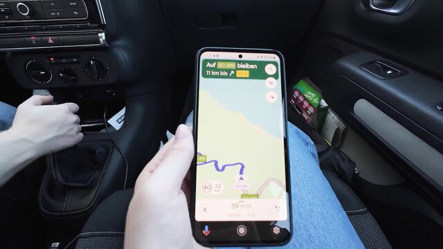 Amateur vlog girl checks map in car on Gran Canaria roadtrip