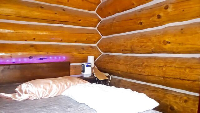 Lady Lorreign in luxurious log cabin bed, satin pillow tease