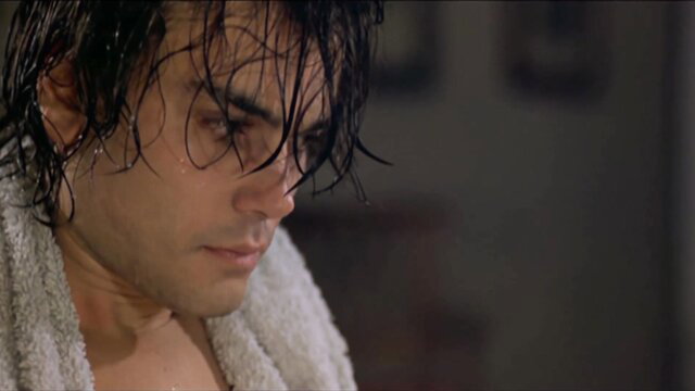Loredana Cannata wet-haired intense gaze in towel erotic scene
