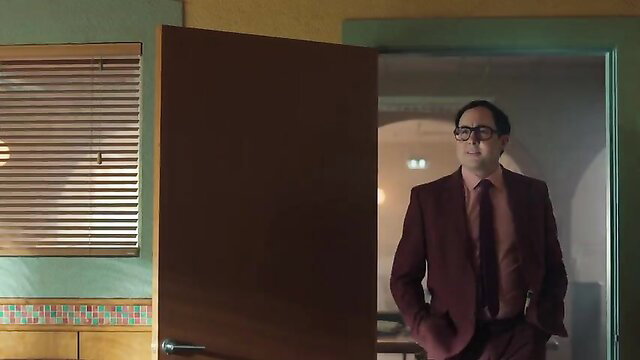 Lana Parrilla in maroon suit hot scene The Rainmaker s01e02