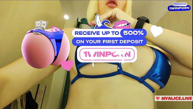Blonde camgirl in blue slingshot bikini flaunts cash & ass, 500% deposit bonus