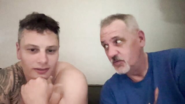 Tattooed young guy shirtless with mature bearded daddy in amateur facesitting preview