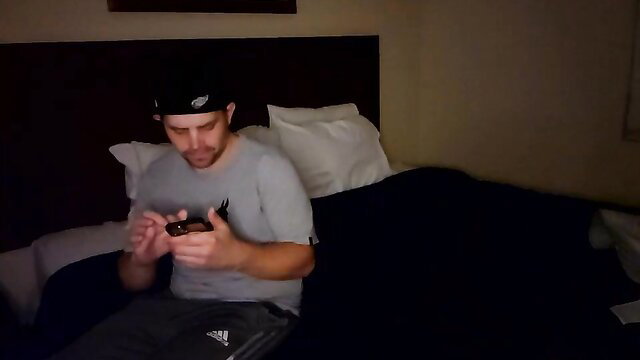 Arky30 teasing on Chaturbate in gray tee and Adidas pants, solo male