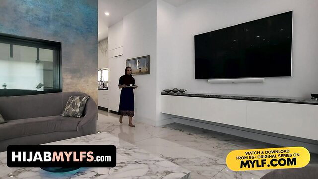 Sasha Love in hijab stands in modern living room - Hijab Mylfs