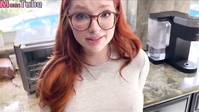 Redhead Naomi Hughes in glasses smiles in kitchen on MoanTube