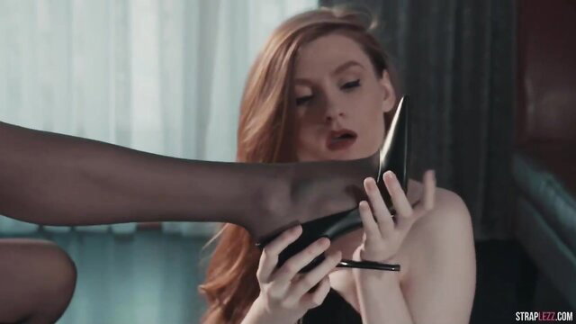 Redhead and black woman in strapon foot fetish lesbian play
