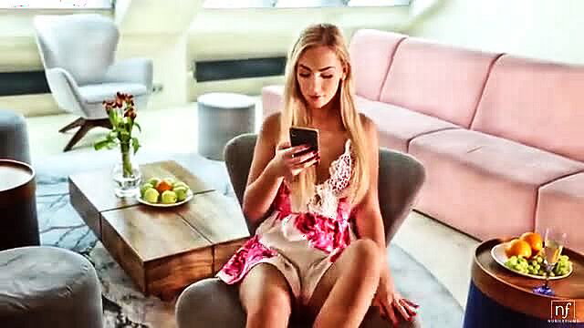 Blonde Jenny Wild in lace lingerie dress on phone, NubileFilms