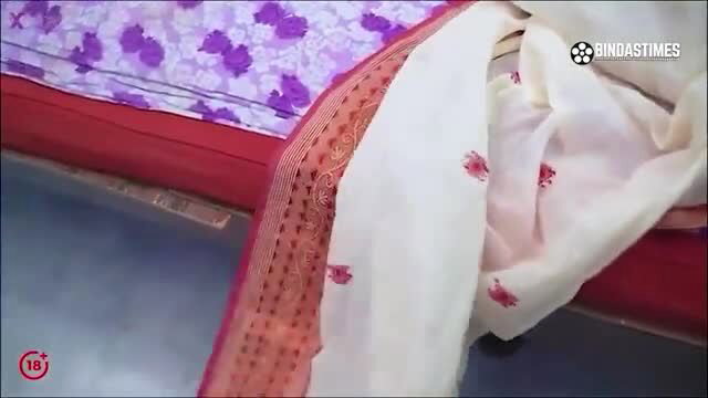 Stunning Indian hussy in sheer white saree on bed