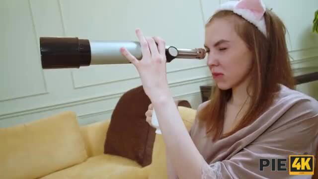 Teen redhead babe in bunny ears holds dildo to face in lingerie