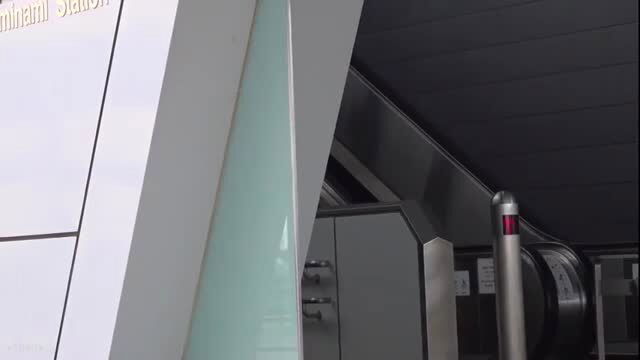 Minami Station crowded train escalator exterior view