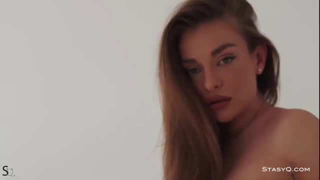 Stunning brunette babe topless with perfect tits and sultry gaze