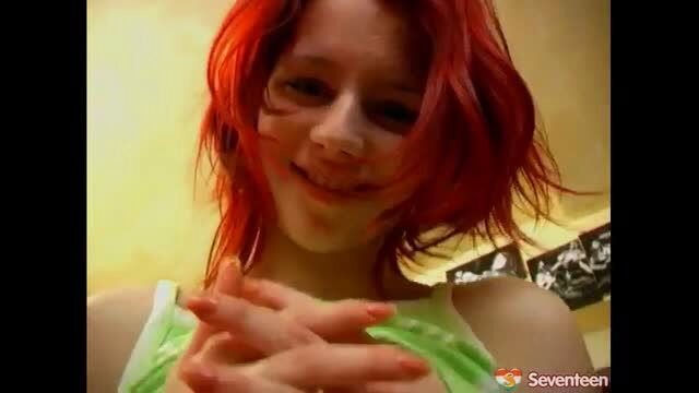 Redhead teen teases with hands in tank top on webcam
