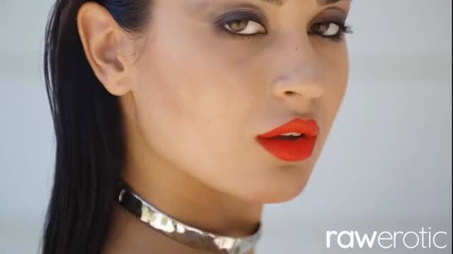 Long-haired beauty with red lips and choker in erotic closeup