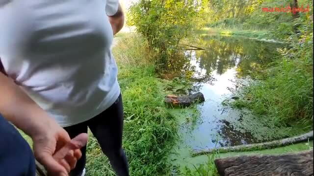 Amateur outdoor handjob in forest by river, public sex