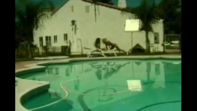 Attractive MILFs licking each other by the poolside