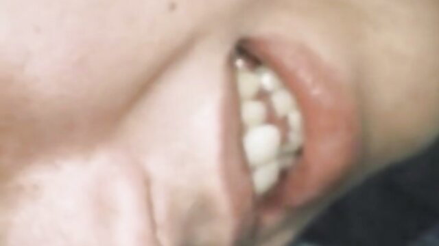 Vintage gay porn closeup of man's open mouth with teeth and lips