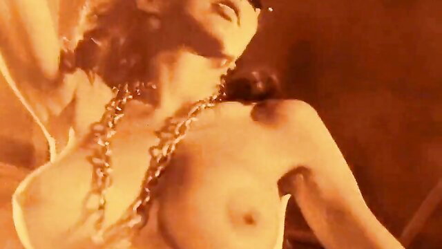 Vintage 60s striptease dancer topless in chains, Jumping Jack Flash
