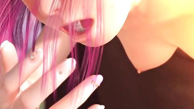 Closeup of Rina's pink-haired face licking lips in erotic tease