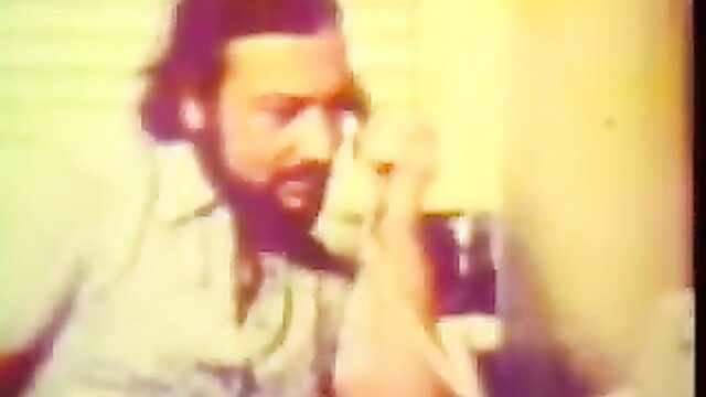Vintage retro guy with long hair beard on phone, Historic Erotica anal scene