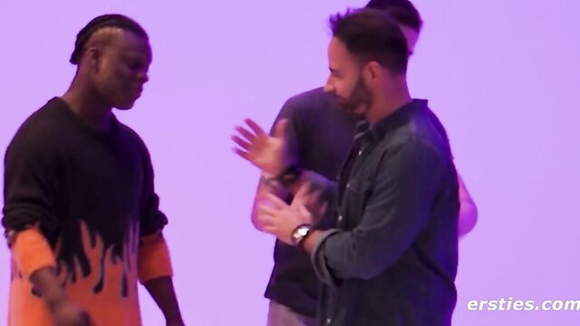 Black guy in flames sweatshirt chats with bearded white dude in Ersties threesome preview