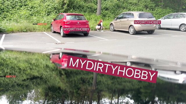 CurvySecret squats to pee by red car in wild outdoor POV parking lot