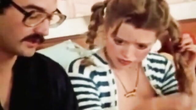 Vintage Babette pigtails teen with man in striped top closeup