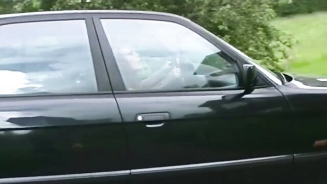 Vintage Swedish blonde in black BMW car, old amateur porno thumbnail