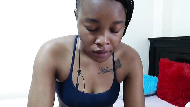 African MILF marina_sea in tight sports bra, teasing cleavage closeup