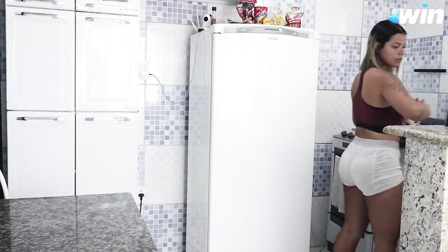 Hot Latina maid in tiny shorts cooking at counter, big ass tease