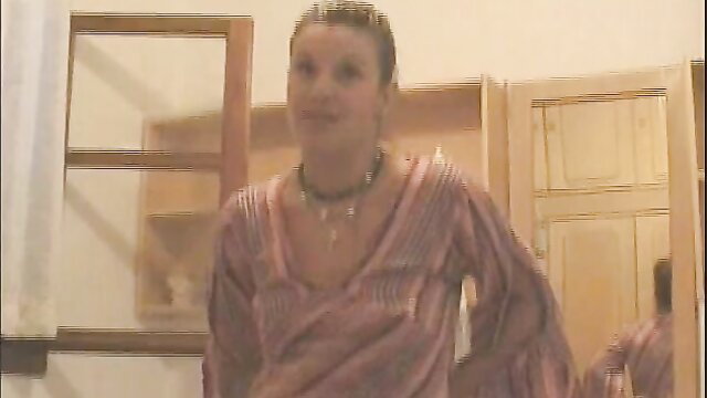 Vintage Greek woman in revealing striped dress smiling seductively