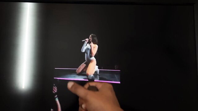 Dua Lipa on stage in tight bodysuit, kneeling sexy performance