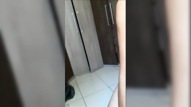 Busty middle-aged blonde arm visible near wardrobe in steamy bedroom