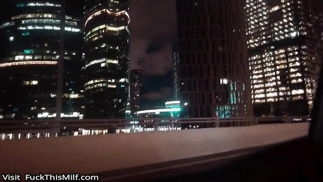 Night city skyline drive view from car, hot date vibes