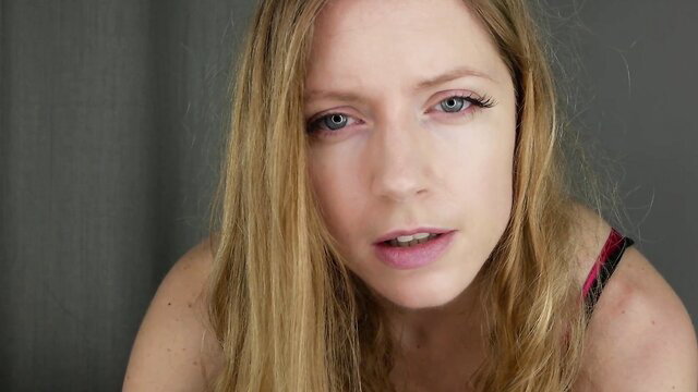 Goddess Allexandra closeup in red lingerie, seductive gaze