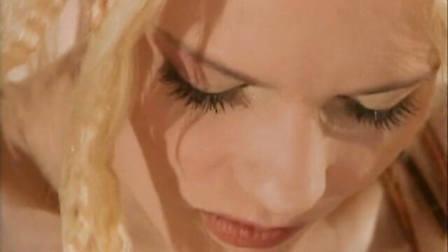 Closeup of hot blonde housekeeper's seductive eyes and lips in porn DP video